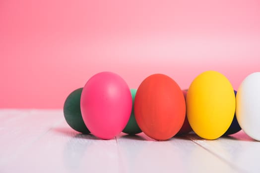 Easter eggs clean on wooden and pink background, easter day concept