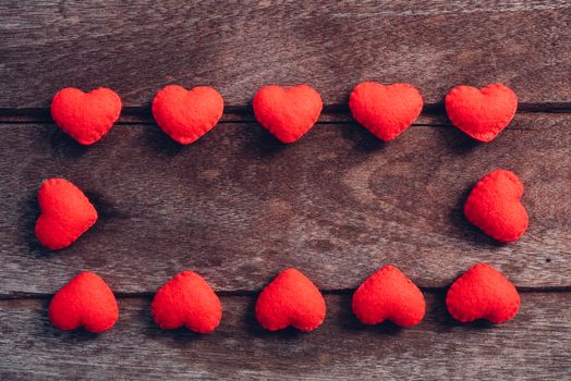 Fabric red heart on wooden background, valentine day concept