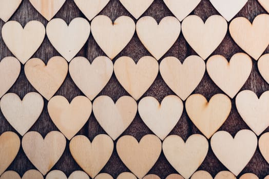 Wood heart pattern on wooden background, valentine day concept
