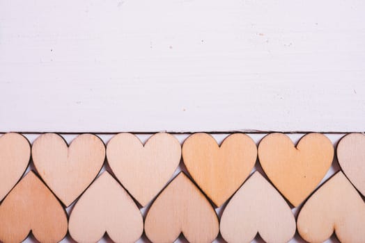 Wood hearts on white wooden background have copy space, valentine day concept