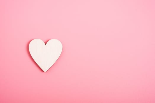 Wood hearts on pink background have copy space, valentine day concept