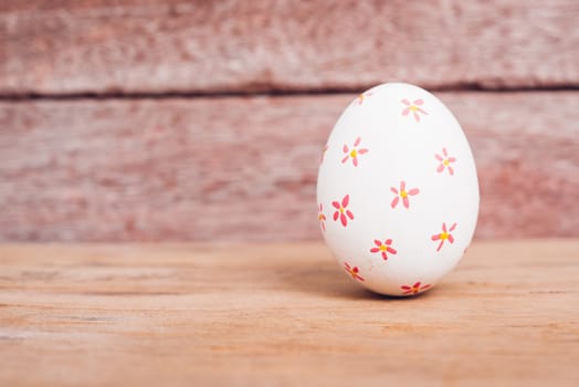 Beautiful Easter White egg on wooden background, Easter day concept