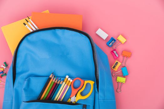 Blue bag backpack for education children on pink background back to school concept