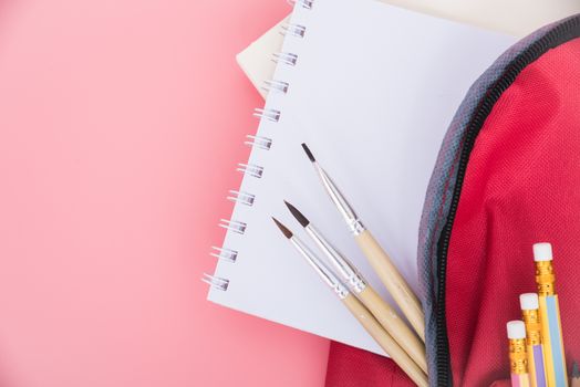 Top view Red bag backpack for education children on pink background back to school concept