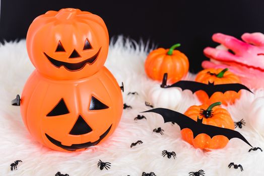 Pumpkin Jack creepy, spider and bat in photo, Halloween day concept on black background