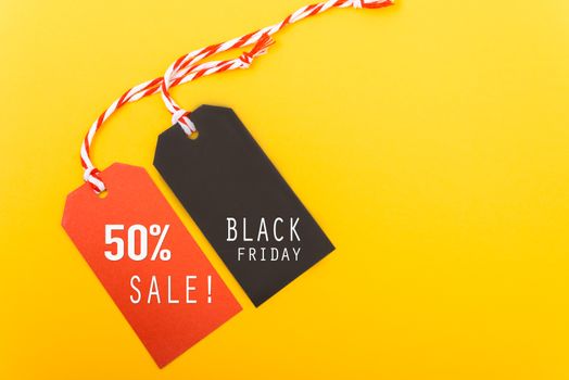 Internet online shopping, Promotion Black Friday text on black tag and 50% sale text on red tag with yellow background