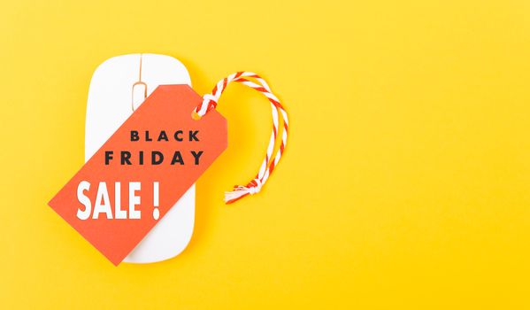 Internet online shopping marketing, Promotion Black Friday sale text on red tag label and white mouse with yellow background