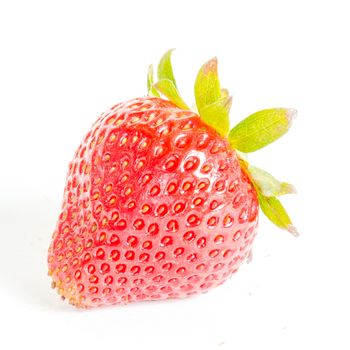 Close-up fresh picked single fresh strawberry isolated on white background. Organic red berry with clipping path and copy space