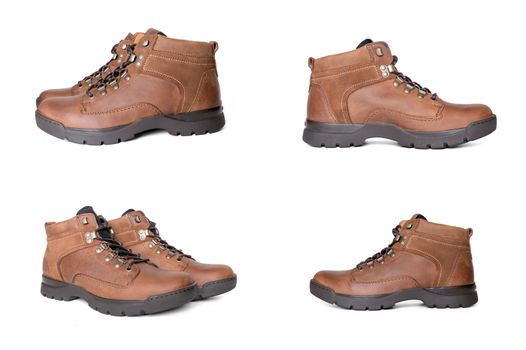 Group of brown boots on white background, isolated product.