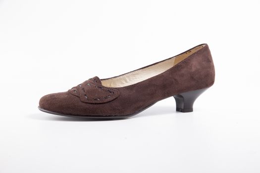 Female brown leather shoe on white background, isolated product.