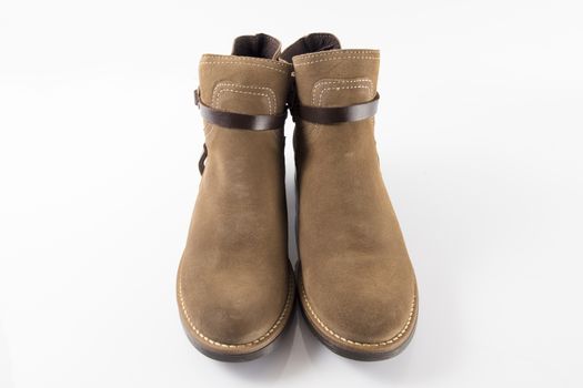 Pair of brown boots on white background, isolated product.