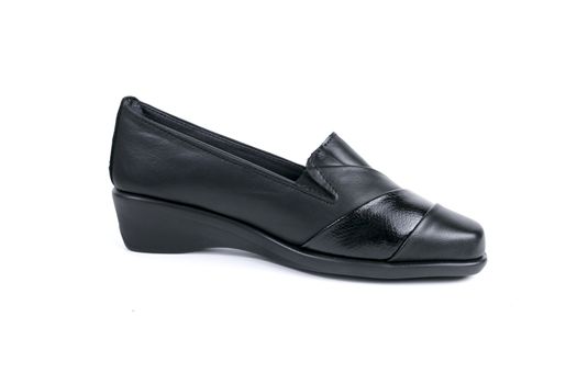 Female black leather shoe on white background, isolated product.