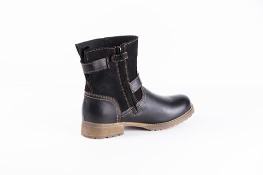 Black boot on white background, isolated product.