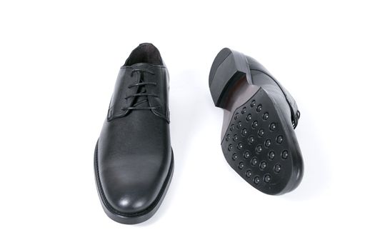 Pair of black shoes on white background, isolated product.