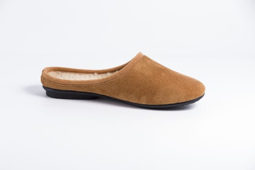 Brown slipper on white background, isolated product.