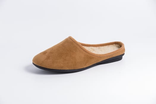 Brown slipper on white background, isolated product.