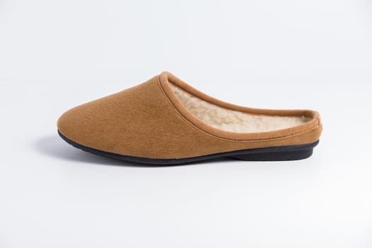 Brown slipper on white background, isolated product.