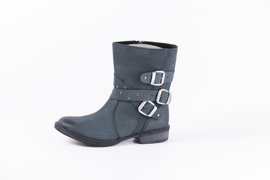 Female blue leather boots, isolated product.