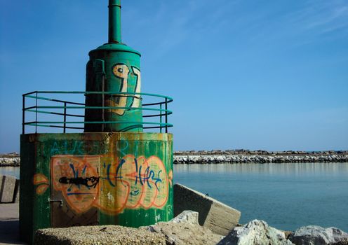 Magnificent wallpaper depicting an old lighthouse in a beautiful pier on the Adriatic sea in Italy. The exact location is Giulianova in Abruzzo.