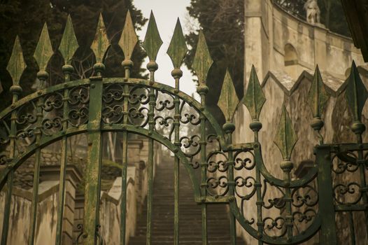 Detail of an old wrought iron gate, a symbol of a bygone era and perfect craftsmanship of an earlier era.