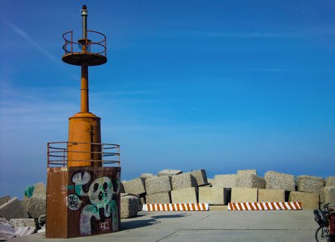 Magnificent wallpaper depicting an old lighthouse in a beautiful pier on the Adriatic sea in Italy. The exact location is Giulianova in Abruzzo.