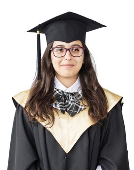 Young girl graduate of the University with glasses, academic cap and black gown, standing isolated on white background