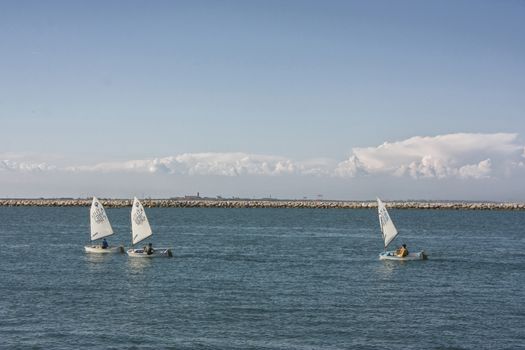 Sailboats while sailing in the Mediterranean Sea. A fun and tranquil sport.