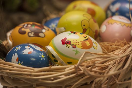 Easter colored eggs in a wicker basket. An Easter Symbol.