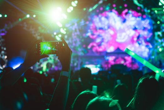 Event people live video festival music concert by hand holding smart mobile phone