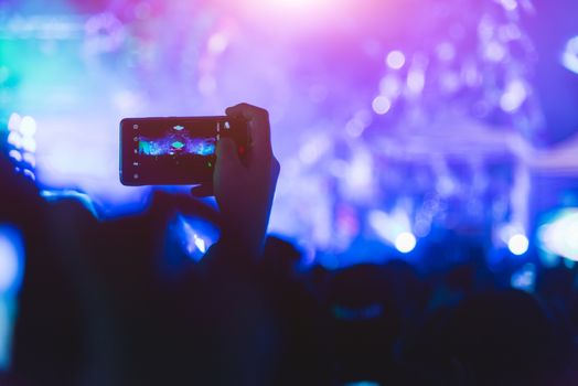 Event people live video festival music concert by hand holding smart mobile phone