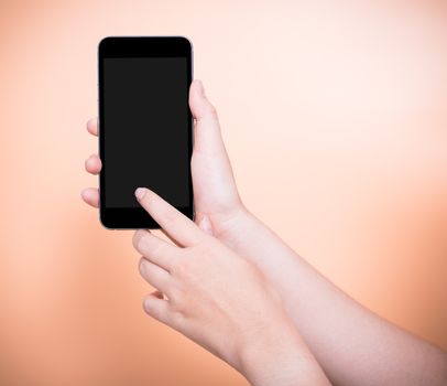 Female finger touch smartphone plus blank black screen on orange color background