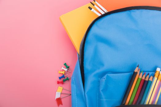 Blue bag backpack for education children on pink background back to school concept