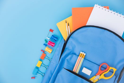 Top view Blue bag backpack for education children on blue background back to school concept