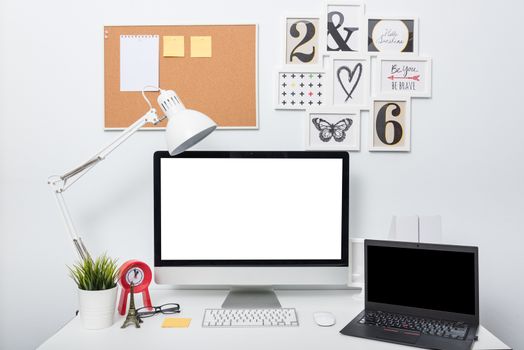 Modern home office computer monitor workspace on white desk