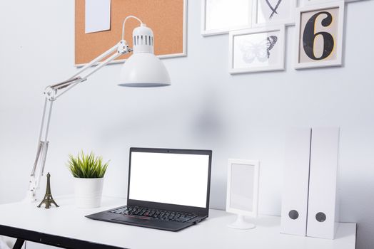 Modern home office notebook laptop computer workspace on white desk