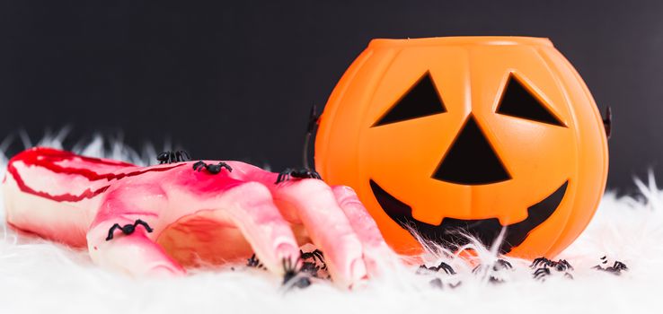 Pumpkin Jack orange color and have blood on hand this horror in Halloween day on black background