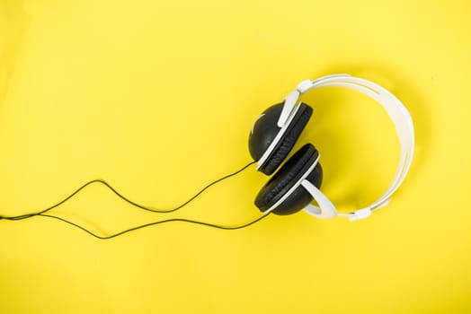 Closeup Music Headphones on a yellow background