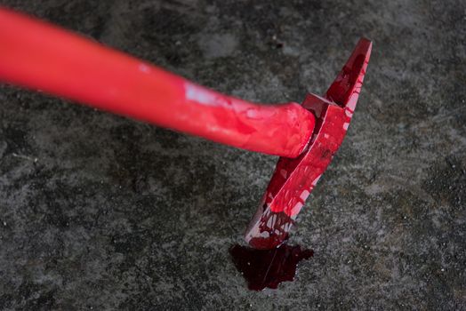 assassin instrument crime axe in puddle blood