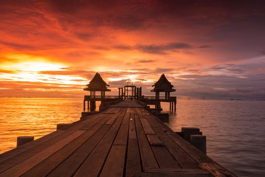 Twilight sunset wood bridge at Djittabhawan Temple tourist attraction in Pattaya, Thailand