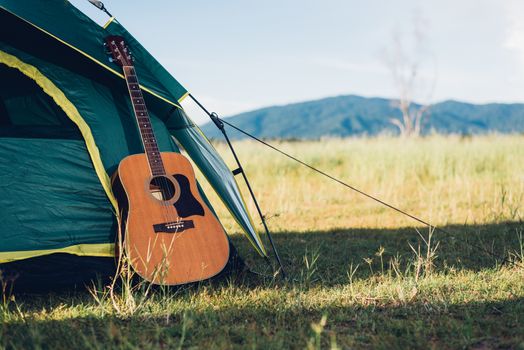 Camping tent and have guitar in nature forest no people