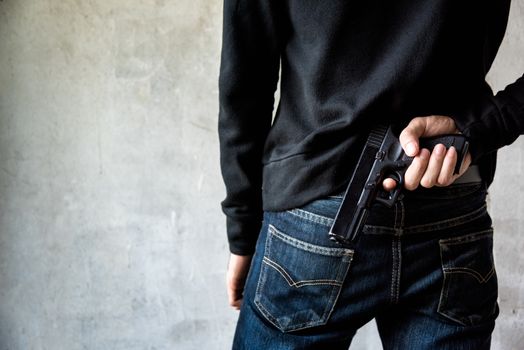 Man hid gun behind their back, robbery, crime, kidnapping