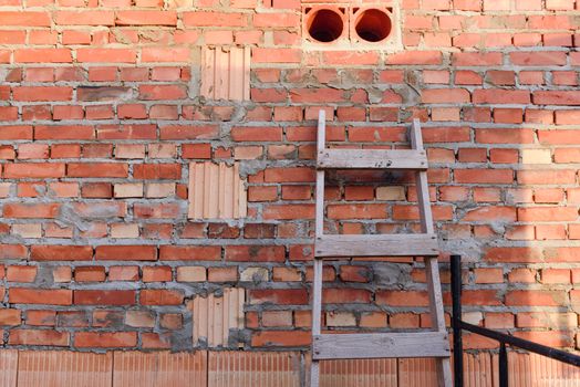Interior of a Unfinished Red Brick House Walls under Construction without Roofing.