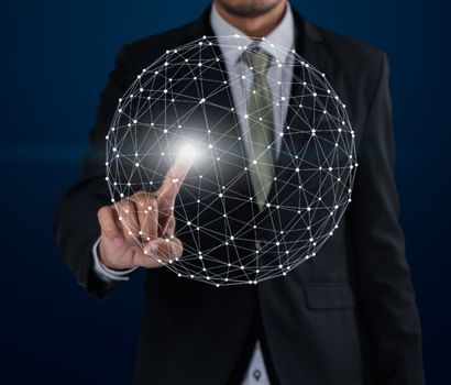 Business man touch networking technologies and social interaction on dark blue background