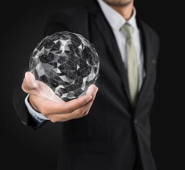 Businessman holding flying earth network connection interface on black background