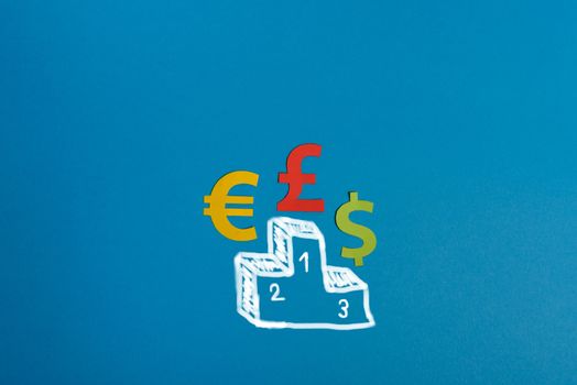 Paper symbols of euro, dollar and british pound currency on podium, blue background. View from above with copy space. Minimalistic simple concept