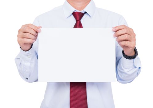 Handsome young business man showing blank paper on chest. Ready for text message