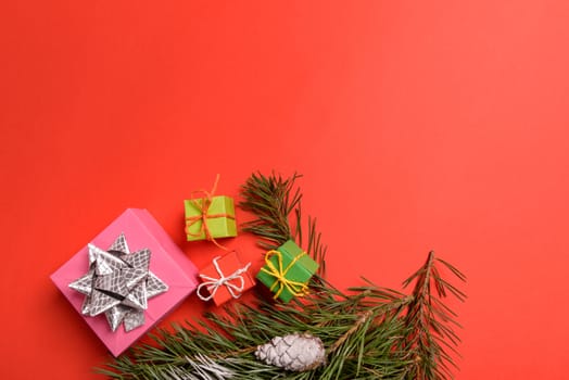 Christmas or New Year background, plain composition made of Xmas decorations and fir branches, flat lay, blank space for a greeting text.