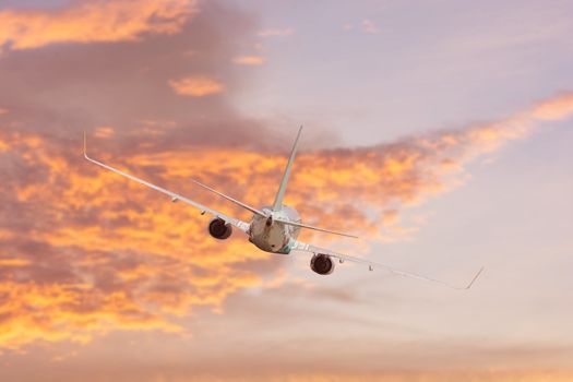 Airplane aft plane in the sky at sunset sky