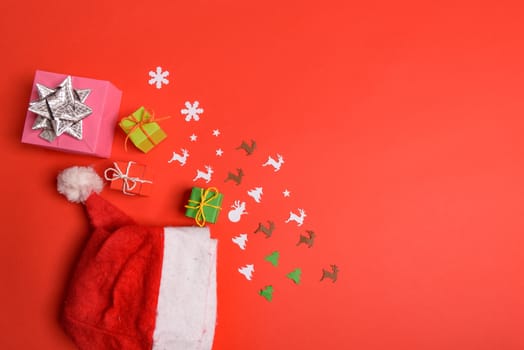 Christmas or New Year background, plain composition made of Xmas decorations and fir branches, flat lay, blank space for a greeting text.