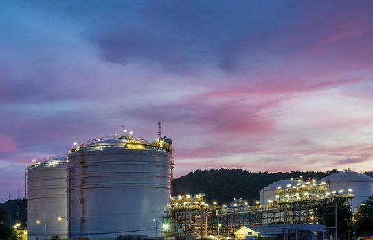 Oil petrochemical refinery plant at sunset twilight